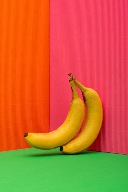 istock Two ripe bananas on a colored background 2125374390