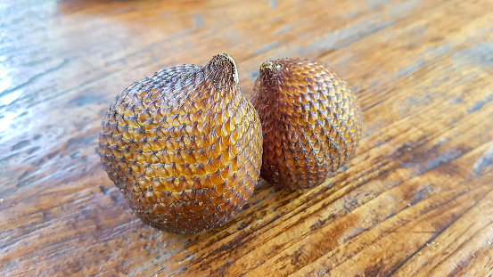 Two snake fruits on a table