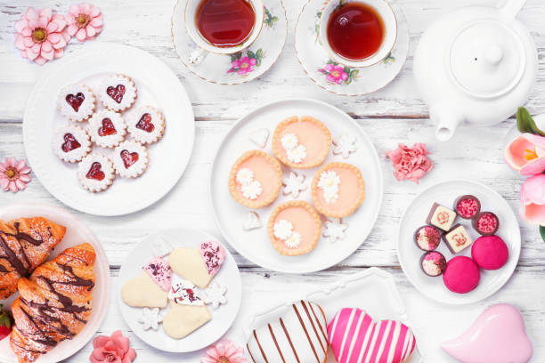 istock Mother's Day tea table scene over a white wood background 2125399199