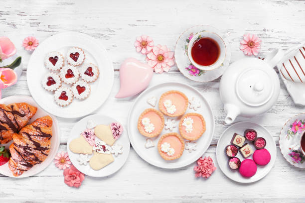 istock Mother's Day tea table scene over a white wood background 2125399212