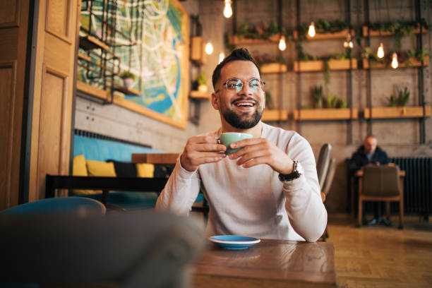 istock Picture of a handsome young man looking thoughtful while having coffee at a cafe. 2125420779