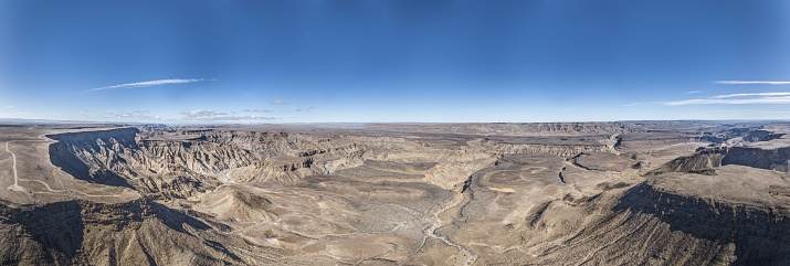 Panoramic drone picture of the Fish River Canyon in Namibia taken from the upper edge of the south side in summer