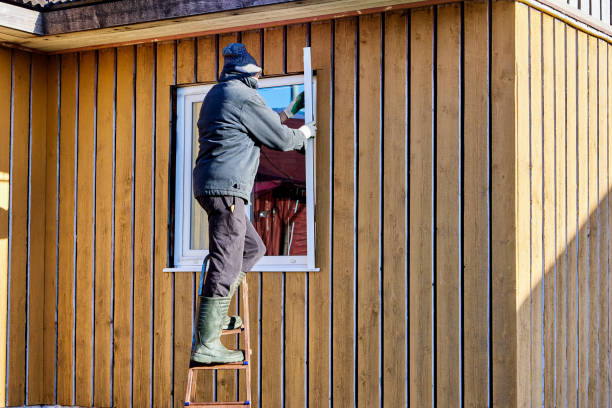 istock Installation exterior metal slopes on window, roofing contractor standing on step ladder on fall day. 2125480756