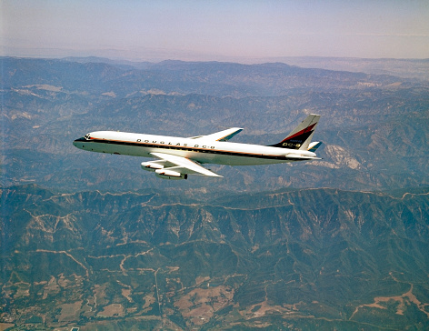 California, USA - between 1958 and 1960: Douglas DC-8-10 flying over the Sierra Nevada Mountains. This airplane, N8008D, was used to conduct the first test flight of the DC-8 in 1958.