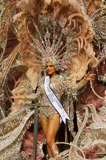 Las Palmas de Gran Canaria, Spain - February 17 2024: Carnival dame greets the public at grand carnival procession