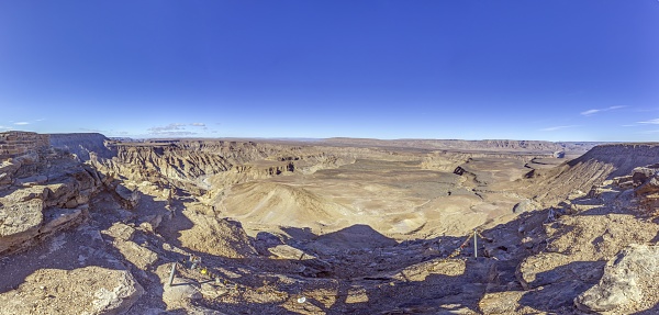 Panoramic picture of the Fish River Canyon in Namibia taken from the upper edge of the south side in summer