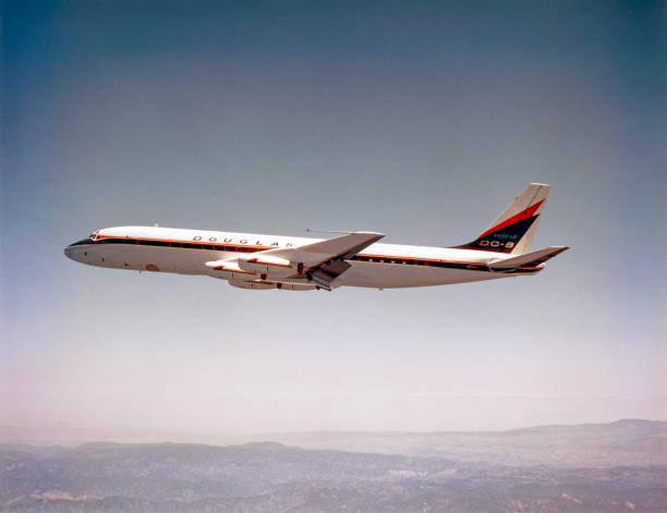 California, USA - between 1958 and 1960: Douglas DC-8-10 flying over the Sierra Nevada Mountains. This airplane, N8008D, was used to conduct the first test flight of the DC-8 in 1958.