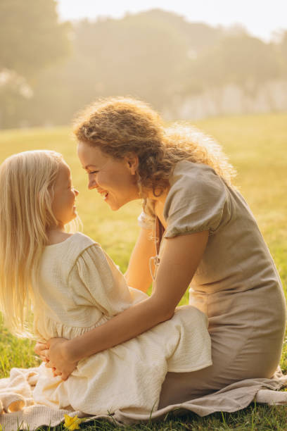 istock Mother and daughter playing at the meadow 2125537342