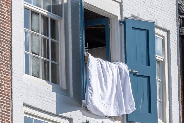medieval building with window and sheets hanging to dry