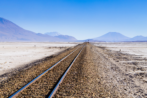 Train tracks perspective view from Bolivia. Bolivian landscape. Salar de Colchani