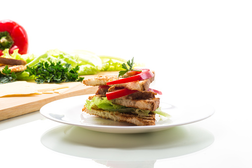 fried toast with chicken, salad, greens isolated on white background .