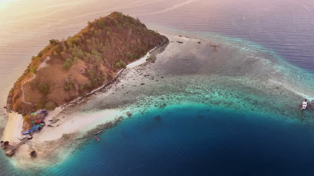 Aerial view of ship in Komodo National Park at sunset scene, Indonesia