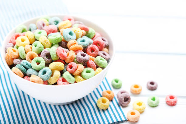 istock Colorful corn rings in bowl on white wooden table 2125629917