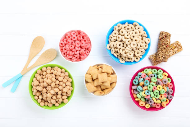 istock Various corn flakes in bowls with granola bars on white wooden table 2125647927