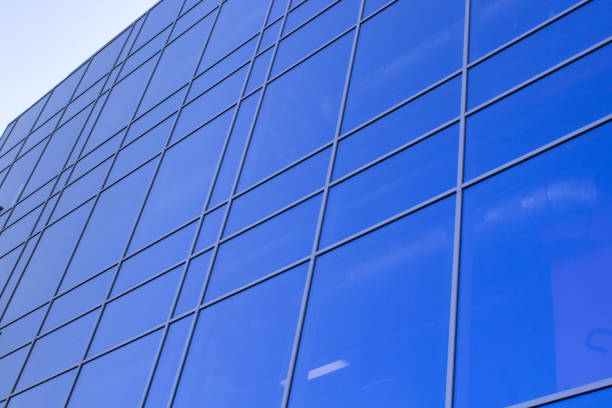 istock glazed facade. glazed facade against a blue background. modern skyscrapers of downtown. 2125652927