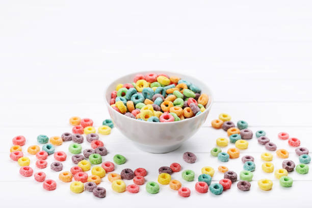 istock Colorful corn rings in bowl on white wooden table 2125653576