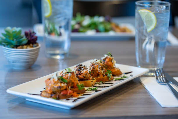 pork sausage meatballs with vodka sauce, parmesan, fresh basil, garlic crostini and a honey-balsamic reduction