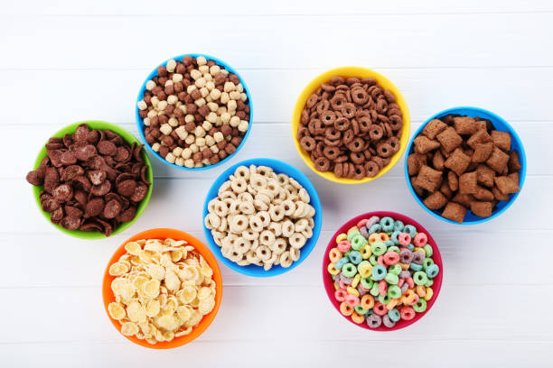 istock Various corn flakes in bowls on white wooden table 2125663927