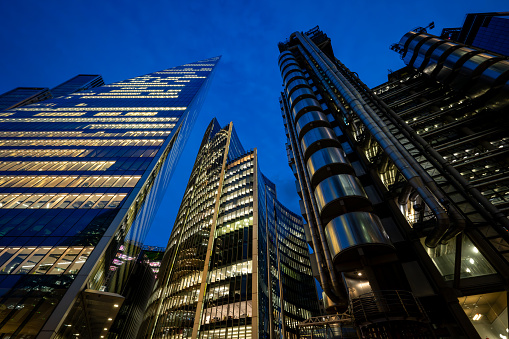 London, UK: Tall buildings in the City of London seen from Fenchurch Street at night. From L-R: the Scalpel, the Willis Building and the Lloyds Building.