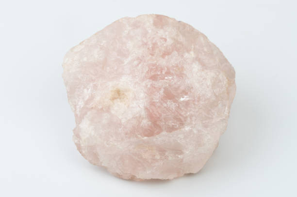 Pink color mineral gem rock stone isolated on white studio background
