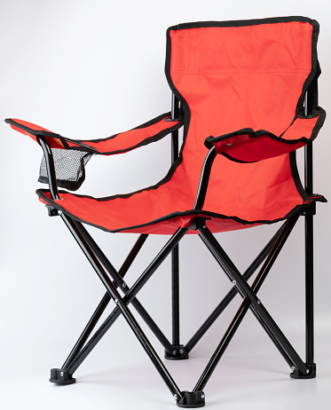 Orange color foldable chair perspective view isolated on white studio background