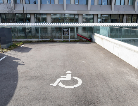 Parking for disabled people near the building. Free parking space. Herlev, Denmark - April 2, 2024