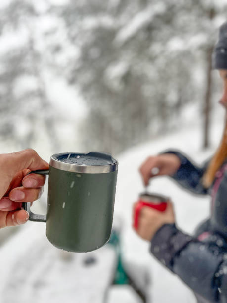 istock Hands holding a coffee cup in cold weather. 2125731359