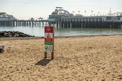 San Diego, CA - August 9, 2022:  City regulations around beaches, cliffs, walkways and parking areas posted for display to public at Crystal Pier, San Diego, California