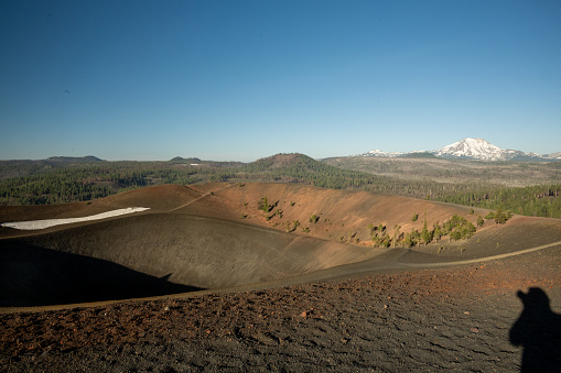 Rim of Cinder Cone with Burned Forest and Lassen Peak in Distance in Lassen Volcanic National Park