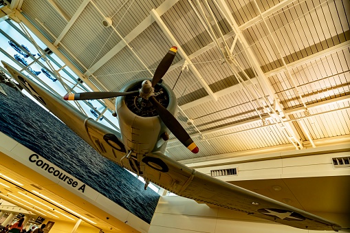 Chicago, IL, USA - 03.25.2024\n- Midway Airport’s U.S. Navy Dauntless dive-bomber that sits above the walkway to Concourse A