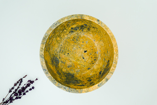 Interior patterns of a marble bowl shot on a white background