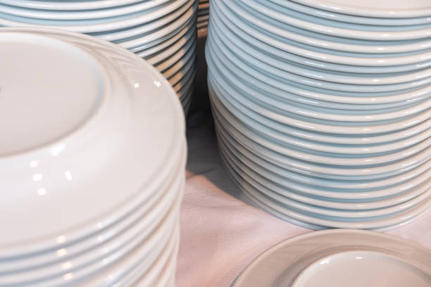 istock many white ceramic dishes piled up after washing 2125820486