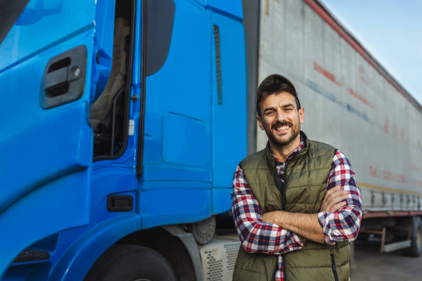 istock Happy confident male driver standing in front on his truck 2125861274