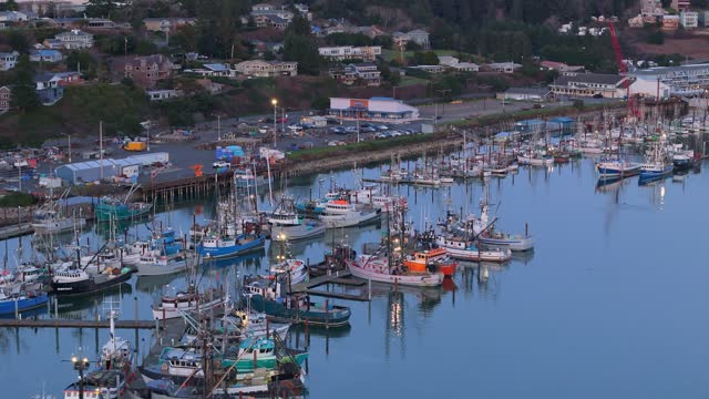 Sunset over Yaquina Bay Newsport Oregon Coast Fishing Boats. Seafood Processing and Tourism.