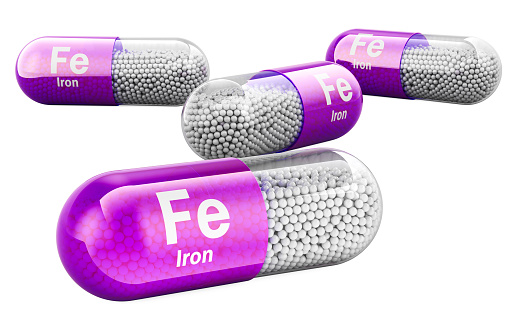 Capsules with ferrum Fe, iron. 3D rendering isolated on white background