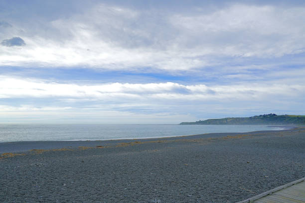The view of the sea, horizon line and clouds seeing from Mangawhai Cliffs walk track. Marine landscape in New Zealand.