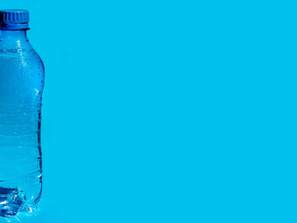istock Banner with Wet Plastic Bottle of Water on Blue Background with Copy Space. 2125889702