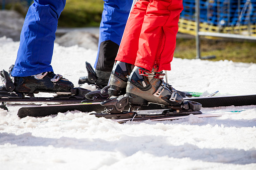 skiers on a snowy slope on a sunny day. leisure