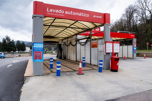 Girona, Spain - March 29, 2024. Efficient Automatic Car Wash Station at a Modern Service Center