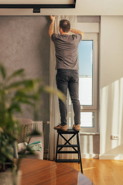 istock Man installing curtain rod at home 2125913672