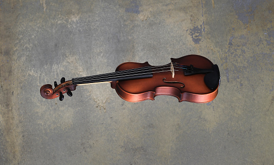 Classical old Baroque Violin on brown background, retro style