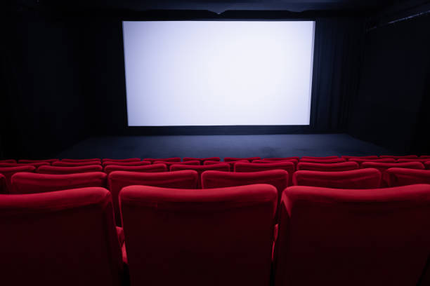 istock Cinema blank wide screen and empty red chairs 2125933469