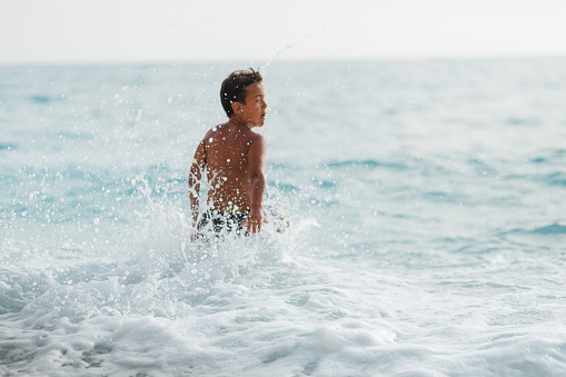 Senior man enjoying sea waves.\nCanon R5