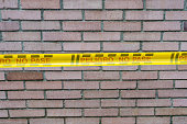 Danger: Cordoned Brick Wall with Yellow Warning Band