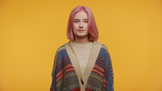 Young Woman With Pink Hair Nodding Head in Agreement