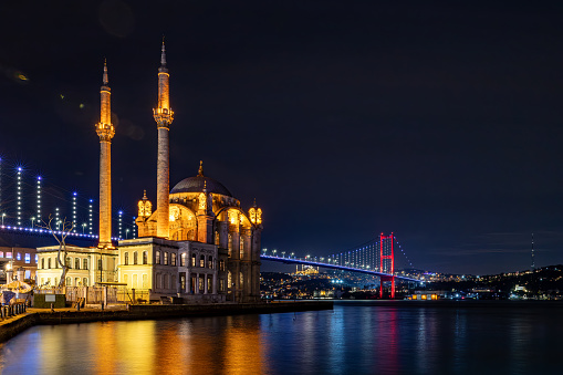Istanbul, Turkey A night view of the Grand Mecidiye Mosque, OrtakÃ¶y Mosque, and the 15 July Martyrs Bridge.