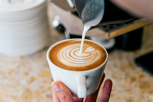 Barista make coffee cup latte art