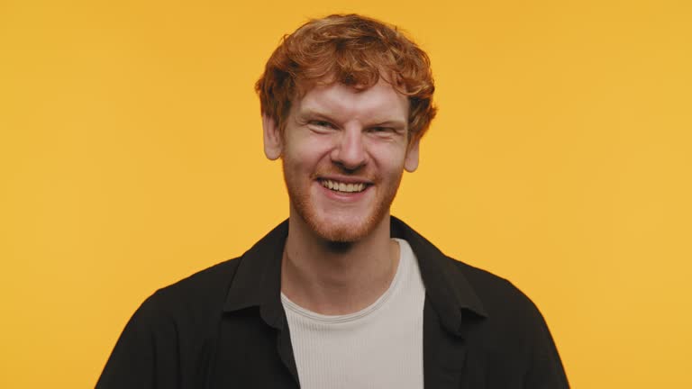 Man Wink and Smile on Yellow Background