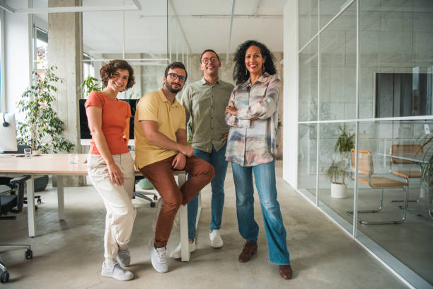 istock Multicultural Call Center Team Showcases Confidence with Crossed Hands in a Modern Office 2126221021