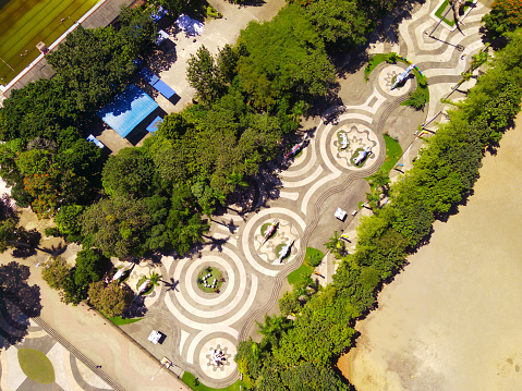 Aerial shot of city park with beautiful floor patterns and trees. Textured Background floor pattern. Aerial photography. Textured details. Shot from a flying drone